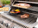 Load image into Gallery viewer, Napoleon OASIS 100 Modular Outdoor Kitchen with 500 Series 32-Inch 4-Burner Gas Grill, stainless steel construction, custom countertop, and rollout propane tank storage.