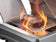 Load image into Gallery viewer, Napoleon Rogue PRO 625 5-Burner Gas Grill with Infrared Side Burner, stainless steel finish, backlit knobs, and integrated sear station for perfect grilling.