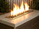 Load image into Gallery viewer, American Fire Products 1/2 inch Black reflective fire glass installed in outdoor fire pit creating dramatic flame reflections