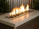 Load image into Gallery viewer, American Fire Products 1/4 inch Black reflective fire glass used in an outdoor fire pit creating dramatic bright flame reflection