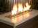 Load image into Gallery viewer, American Fire Products Bronze reflective fire glass used in outdoor fire pit creating warm flame reflection effect