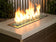 Load image into Gallery viewer, American Fire Products Evergreen reflective fire glass used in outdoor fire pit creating a bold green flame reflection effect