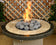 Load image into Gallery viewer, American Fire Products extra large gray tumbled lava stones 4 to 6 inch fire pit media use case showing volcanic rock as top layer decorative fire feature in gas fire pit with flames