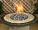 Load image into Gallery viewer, American Fire Products large gray lava stone 2 to 4 inch fire pit media use case in gas fire pit with flames and decorative lava rock