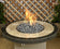 Load image into Gallery viewer, American Fire Products medium gray lava stone 1–2 inch fire pit media use case showing decorative volcanic rock in gas fire pit with flames and enhanced flame performance