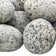 Load image into Gallery viewer, Close-up of American Fire Products medium white tumbled element stone with natural white and black speckled finish