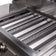 Load image into Gallery viewer, Close-up of Blaze LBM 25-Inch 3-Burner Freestanding Gas Grill in Stainless Steel with Cart with perforated grates