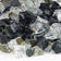 Load image into Gallery viewer, Close up of 1/2 inch Las Vegas Reflective Fire Glass showing black, white, and yellow reflective tempered glass pieces