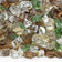Load image into Gallery viewer, Close up of 1/2 inch Yosemite Reflective Fire Glass showing copper, evergreen, and gold reflective tempered glass pieces