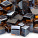 Load image into Gallery viewer, Close up of Copper Luster 2.0 Fire Glass Cubes showing premium copper color with reflective luster finish on each glass cube