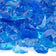 Load image into Gallery viewer, Close up of Turquoise Medium tempered fire pit glass showing bright turquoise decorative glass pieces with reflective shine