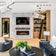 Load image into Gallery viewer, Empire Boulevard 60-inch direct vent linear gas fireplace installed in a modern living room with logs and rocks