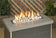 Load image into Gallery viewer, Cottage white linear lite stones in a fireplace with visible flames creating a warm, cozy, and elegant fire feature display
