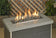 Load image into Gallery viewer, Fireplace linear lite stones in thunder grey color with visible flame, modern ceramic fire media arranged in a linear gas fireplace design for indoor and outdoor fire features.