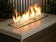 Load image into Gallery viewer, Indoor fireplace featuring glacier ice fire beads with glowing flames and modern decorative fire design