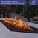 Load image into Gallery viewer, Natural volcanic lava rocks used as a base and decorative layer in an outdoor fire pit, enhancing heat distribution and aesthetics