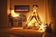 Load image into Gallery viewer, Napoleon Entice 36-inch wall-mounted electric fireplace displayed in a cozy room with warm lighting