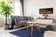 Load image into Gallery viewer, Napoleon Entice 50-inch electric fireplace mounted above a cabinet in a contemporary living room