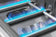 Load image into Gallery viewer, Napoleon Prestige PRO 665 Elite stainless steel gas burners operating with blue flames