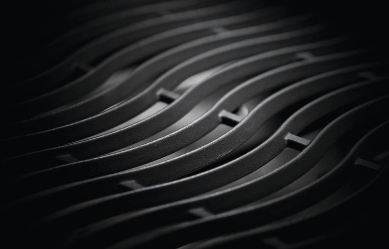 Load image into Gallery viewer, Close-up of a textured black surface with wavy patterns