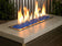 Load image into Gallery viewer, Outdoor fire pit filled with Turquoise Medium fire pit glass creating colorful flames and a modern outdoor living design