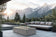 Load image into Gallery viewer, Planika Cabo Fire Table Kreta installed on a modern outdoor patio with decorative flames