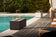 Load image into Gallery viewer, Planika Cabo Laurent installed on a luxury outdoor patio with modern bioethanol flames
