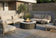 Load image into Gallery viewer, Planika Comet Fire Table Daze installed on a modern outdoor terrace with decorative flames