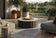 Load image into Gallery viewer, Planika Comet Fire Table Kreta installed on a modern outdoor patio with decorative flames