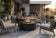 Load image into Gallery viewer, Planika Comet Fire Table Laurent installed on a luxury outdoor terrace with decorative flames