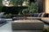 Load image into Gallery viewer, Planika Galaxy Kreta Table fire table installed on modern outdoor patio with elegant gas flames