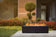 Load image into Gallery viewer, Planika Galio Black Manual freestanding outdoor gas fireplace installed on modern patio
