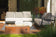 Load image into Gallery viewer, Planika Galio Corten freestanding outdoor gas fireplace installed on a modern patio