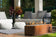 Load image into Gallery viewer, Planika Galio Corten freestanding outdoor gas fireplace installed on a modern patio