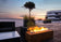Load image into Gallery viewer, Planika Galio Corten freestanding outdoor gas fireplace installed on a modern patio