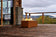 Load image into Gallery viewer, Planika Galio Corten freestanding outdoor gas fireplace installed on a modern patio