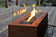 Load image into Gallery viewer, Planika Galio Corten freestanding outdoor gas fireplace installed on a modern patio