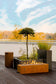 Load image into Gallery viewer, Planika Galio Corten freestanding outdoor gas fireplace installed on a modern patio
