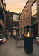 Load image into Gallery viewer, Planika Lighthouse gas patio heater in modern outdoor patio setting with warm flame ambiance