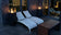 Load image into Gallery viewer, Planika Lighthouse gas patio heater in modern outdoor patio setting with warm flame ambiance