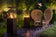 Load image into Gallery viewer, Planika Lighthouse gas patio heater in modern outdoor patio setting with warm flame ambiance