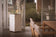 Load image into Gallery viewer, Planika Porto Daze freestanding fireplace used in a modern outdoor lounge area