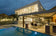 Load image into Gallery viewer, Planika Porto Laurent freestanding fireplace used in a modern outdoor lounge setting