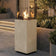Load image into Gallery viewer, Planika Porto Nacre freestanding fireplace used in a modern outdoor lounge area