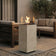 Load image into Gallery viewer, Planika Porto Nacre freestanding fireplace used in a modern outdoor lounge area