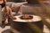 Load image into Gallery viewer, Planika Stella Daze outdoor gas fire table installed on modern luxury patio with decorative flames