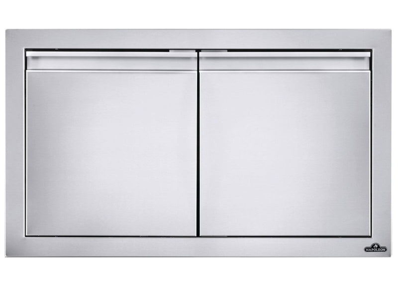 Load image into Gallery viewer, Napoleon 30-Inch Stainless Steel Small Double Doors for outdoor kitchens with soft-closing hardware, anodized aluminum handles, and seamless trim.
