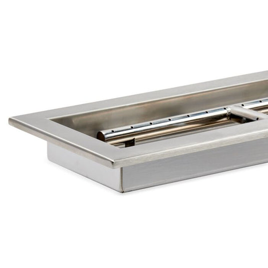 Close-up detail of stainless steel construction of linear burner pan showing brushed metal surface and burner slot design for fire pit use