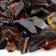 Load image into Gallery viewer, Close-up of American Fire Products Auburn Recycled Medium Fire Glass showing color-infused tempered glass with a reflective finish
