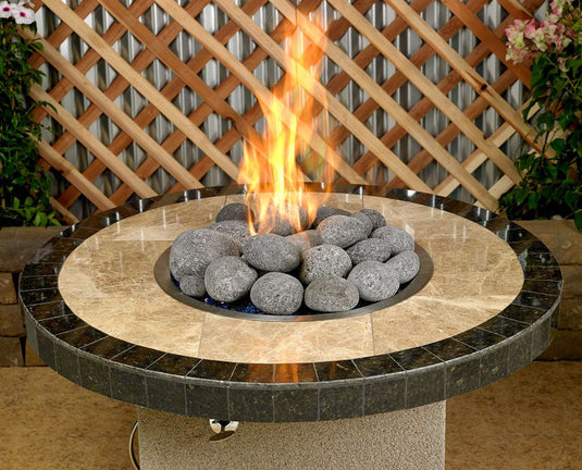 American Fire Products extra large gray tumbled lava stones 4 to 6 inch fire pit media use case showing volcanic rock as top layer decorative fire feature in gas fire pit with flames